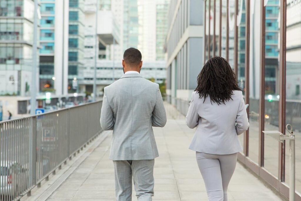 _backs-business-colleagues-wearing-office-suits