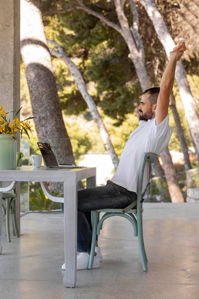 _full-shot-man-sitting-chair